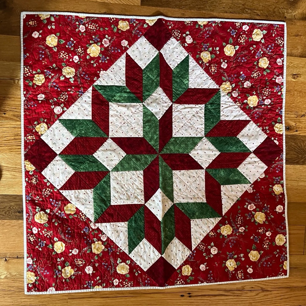 Festive Star Quilt with Floral Accents